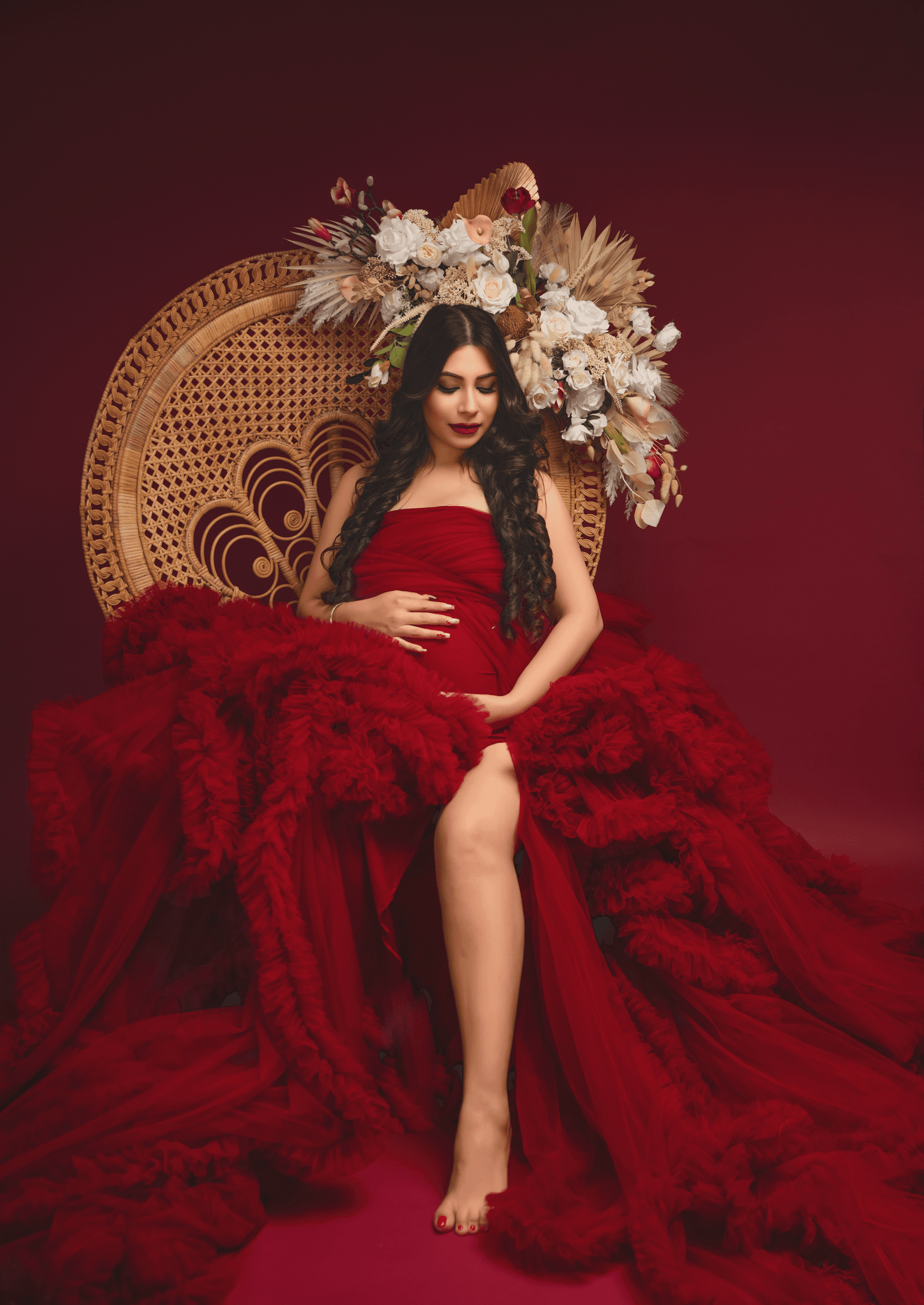 Maternity photoshoot gallery preview showing a pregnant woman in a beautiful gown