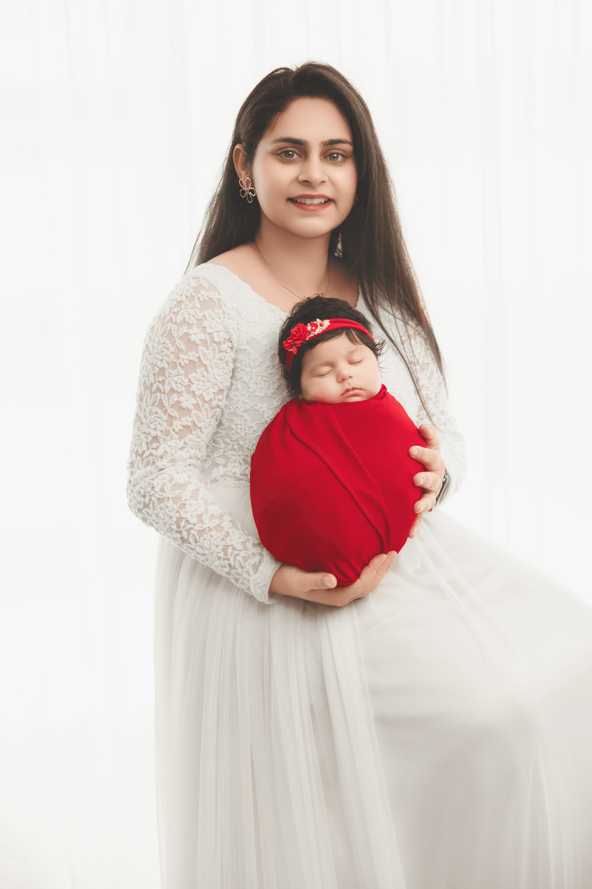 Newborn photoshoot gallery preview with a close-up of a sleeping baby